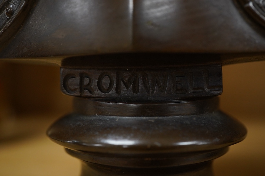 Two bronze busts of Oliver Cromwell, indistinctly signed and Thomas Carlyle, largest 26cm high
